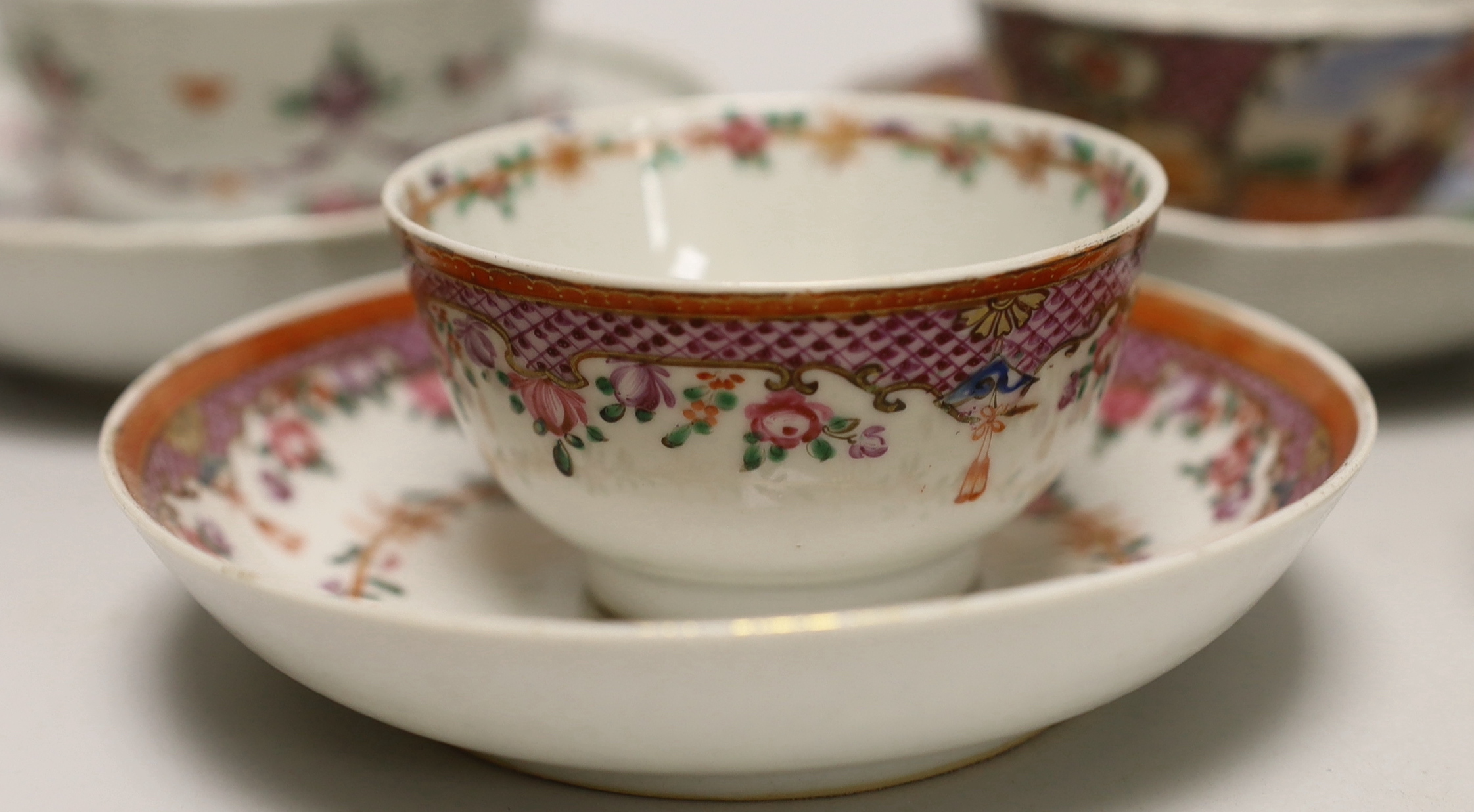 Three 18th century Chinese famille rose tea bowls and matching saucers, a Caughley teabowl and saucer and a single tea bowl and smaller tea bowl